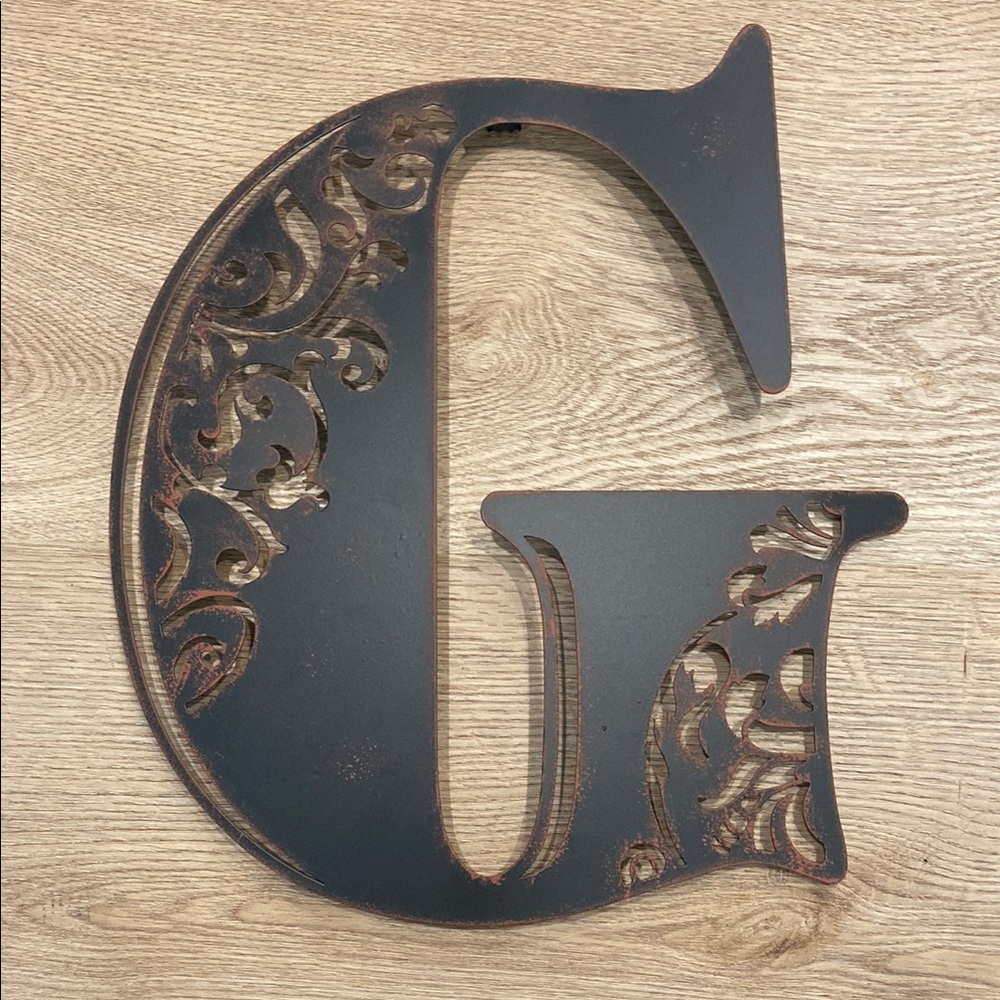 Brown Metal Letter “G” Wall Decor with Rustic Charm